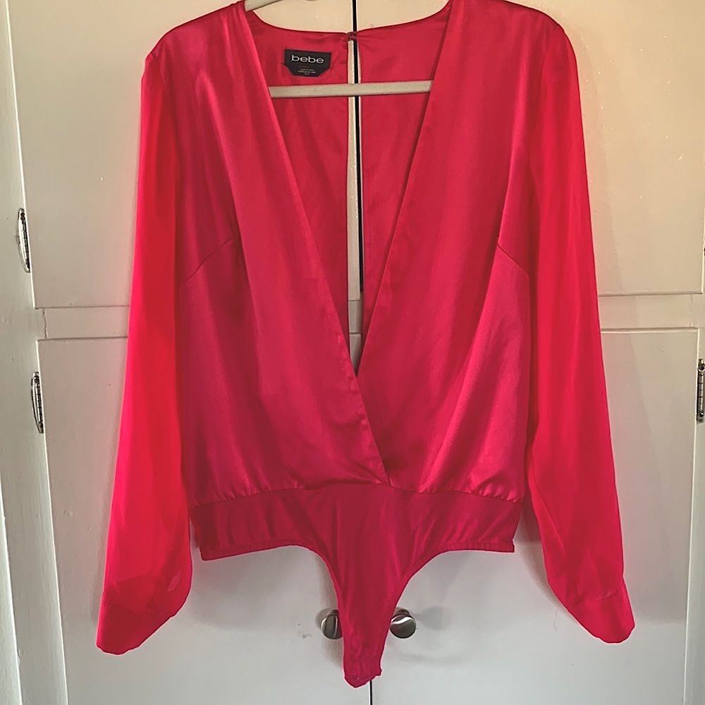 Bebe fuchsia long sleeve bodysuit , Deep V neck front and back.
